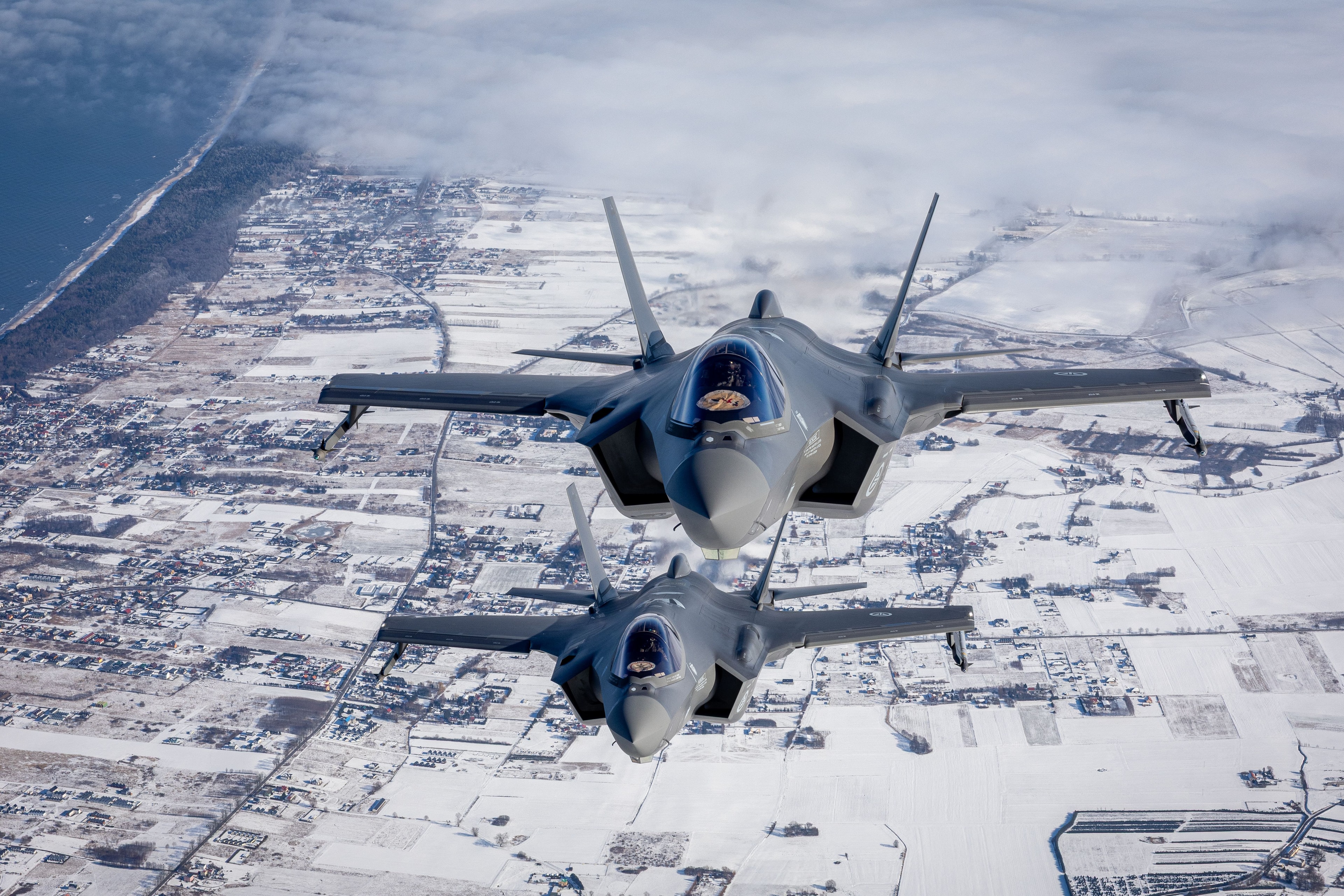 Two jet plains in snowy terrain